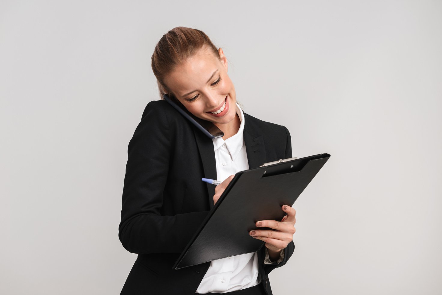 Smiling Blonde Business Woman Standing Isolated